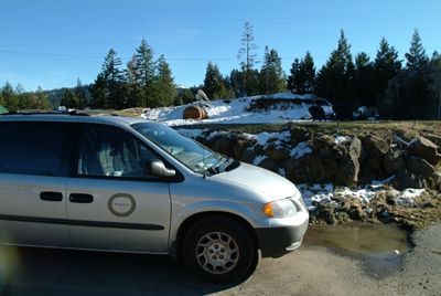 Parked next to some snow.