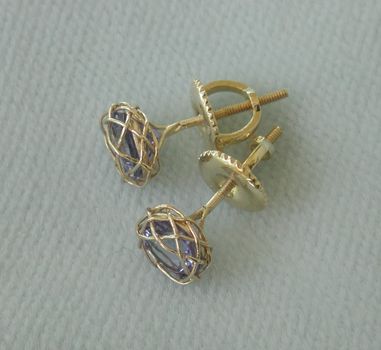 Tanzanite earrings, two 5x7 18K settings.